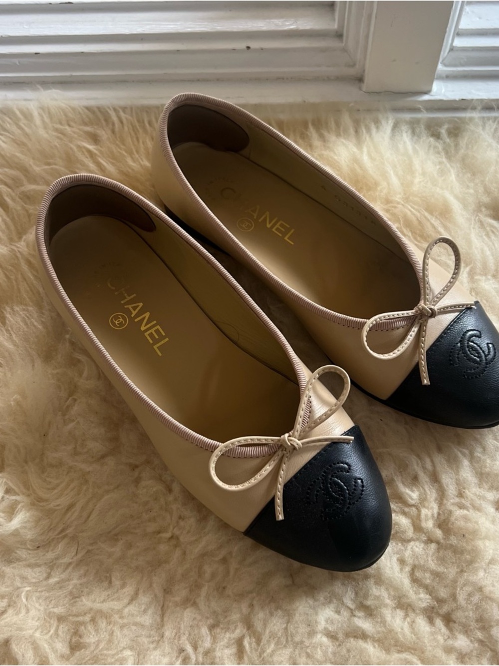 CHANEL Beige Leather Ballet Flats with Black Cap Toe and Bow Size 37C